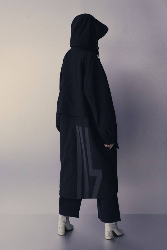 Long black coat, back turned